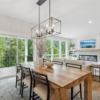 Pheasant Run Sadie Cottage Rambler Detached Villa – Dining room with doors to deck and view to great room