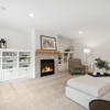 Pheasant Run Sadie Cottage Rambler Detached Villa – Lower Level rec room cabinets and fireplace