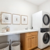 Pheasant Run Sadie Cottage Rambler Detached Villa – Main level laundry with folding counter and full size laundry appliances