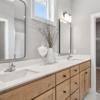 Pheasant Run Sadie Cottage Rambler Detached Villa – Primary bathroom with double sinks, quartz tops and elevated windows
